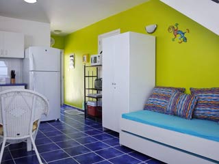 View of Kitchen and Twin Bed on Main Level of 8A