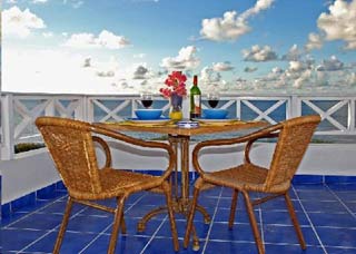 Dining on the Balcony at 'Ocean Front Oasis'